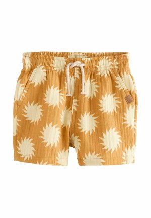Oranje shorts met een zonnenpatroon in crème, voorzien van een elastische tailleband, trekkoord en zijzakken voor extra gemak.