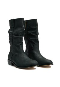 Black leather knee-high boots with a slightly slouchy design, a side zipper, and a low stacked heel. Textured surface with minimal detailing.