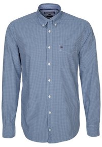 Camisa de manga larga a cuadros en azul y blanco con cuello abotonado, bolsillo en el pecho y parche con logo en el lado izquierdo. Material de algodón.