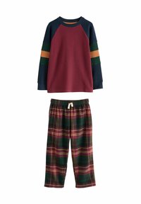 Red sweatshirt with navy, green, and orange striped sleeves; paired with green and burgundy plaid pajama pants with an elastic waistband.
