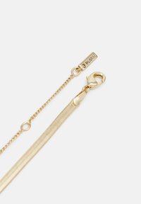 Gold-toned chain bracelet featuring a sleek design with a lobster clasp and a branded tag reading "PILGRIM." Smooth, textured links.