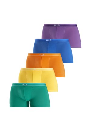 Male torso wearing blue fitted boxer briefs, hand pulling waistband slightly outward, plain background.