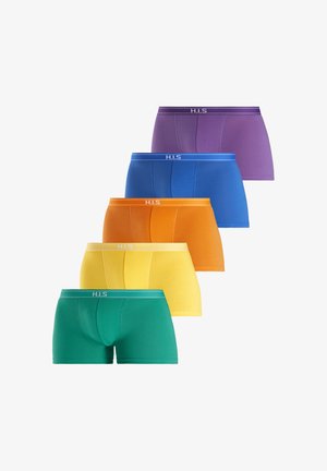 Male torso wearing blue fitted boxer briefs, hand pulling waistband slightly outward, plain background.