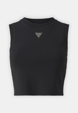 Top crop noir sans manches en tissu texturé, avec un col haut et un accent décoratif triangulaire argenté à l'avant.