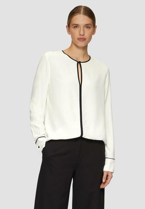 Witte blouse met zwarte piping, met een ronde hals en uitsparing. Lange mouwen met knoopmanchetten, zachte stof en een comfortabele pasvorm.
