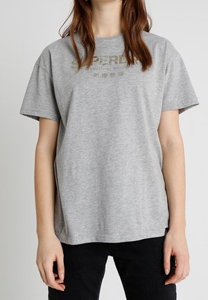 T-shirt in cotone grigio con una vestibilità rilassata e maniche corte, caratterizzato da un semplice design del logo in oro nella zona del petto.
