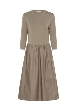 Pikkade varrukatega kleit heledast pruunist puuvilla segust, millel on mugav piht ja avar seelik. Sile tekstuur, ümmargune kaelus ja kroogitud vöökoht.