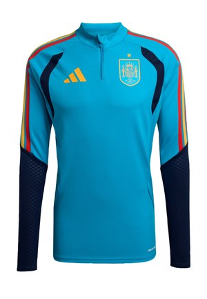 Blue athletic long-sleeve jersey with a high collar, featuring red and yellow stripes, dark blue sleeves, and a Spain national emblem.