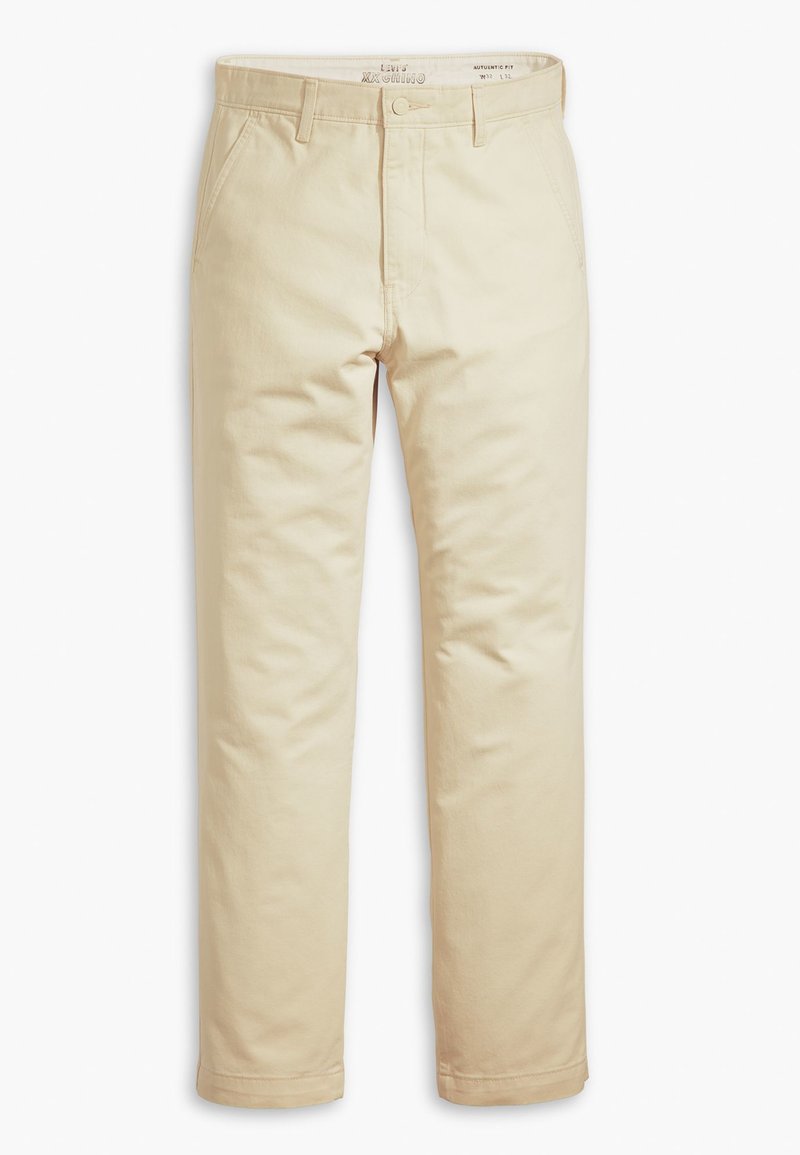 Pantalons kaki beiges en twill de coton, avec une coupe droite, des passants de ceinture, des poches avant et une texture lisse.