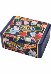 Metallisk rektangulær dåse, blå bund med farverige ferietema grafikker, herunder figurer og dekorationer. "Fossil" logoet er tydeligt præsenteret.