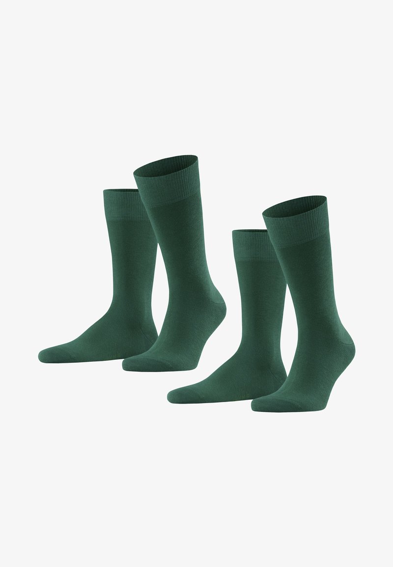 Grüne Baumwollsocken, knöchellang, mit einem gerippten Bund und glattem Material. Vier Paar ausgestellt, mit einheitlicher Farbe und Design.