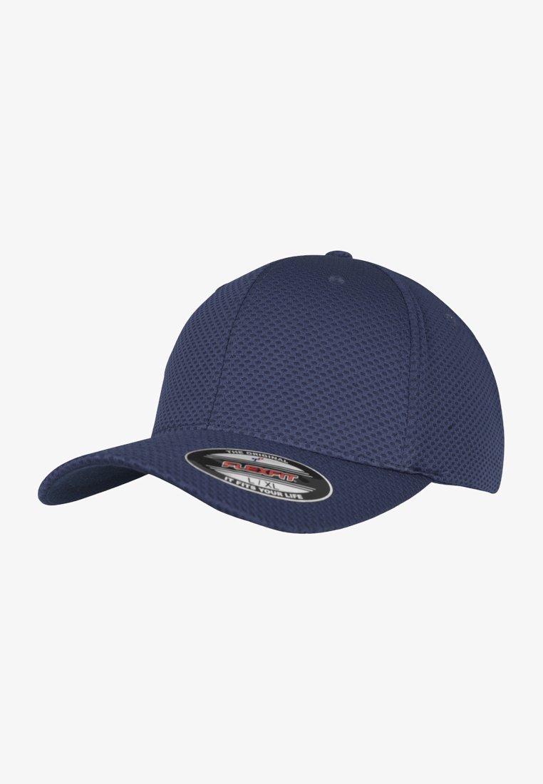 Navy baseball cap made of textured fabric, featuring a curved brim and a branded interior tag. Designed with a flexible fit.