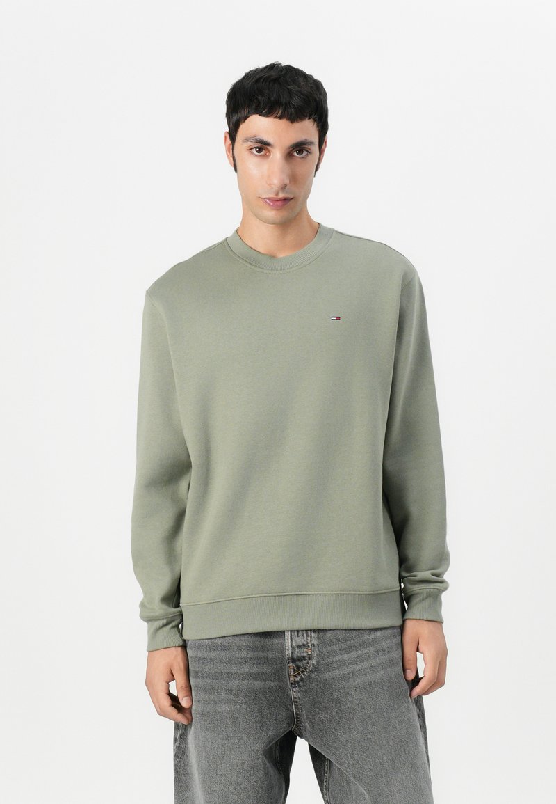 Lichtgroene sweatshirt van een katoenmix, met een ronde hals, geribde manchetten en een klein logo op de borst. Casual ontwerp, ontspannen pasvorm.
