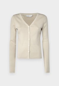 Beige ribkovaná cardigan s dlouhými rukávy, V-výstřihem a řadou šesti malých bílých knoflíků vpředu. Měkká látka s přiléhavým střihem.