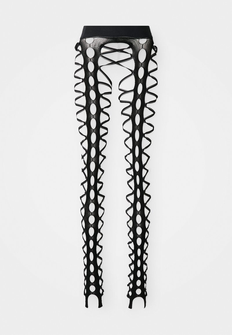 Leggings neri fino alla coscia con un design con lacci, grandi cerchi intagliati e dettagli ondulati lungo i lati. Texture liscia.