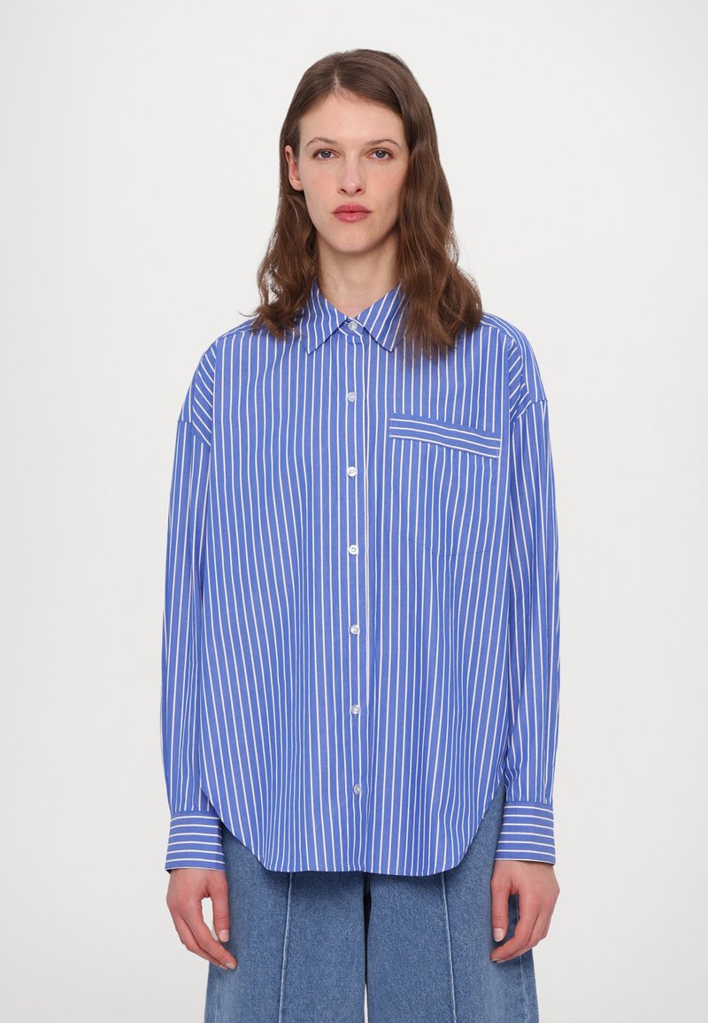 Blue and white striped button-up shirt with a chest pocket, long sleeves, and a relaxed fit. Made from lightweight fabric.
