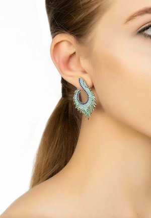 Silver-tone earrings with a swirling leaf design, embellished with blue and green crystals, featuring a smooth surface and intricate detailing.