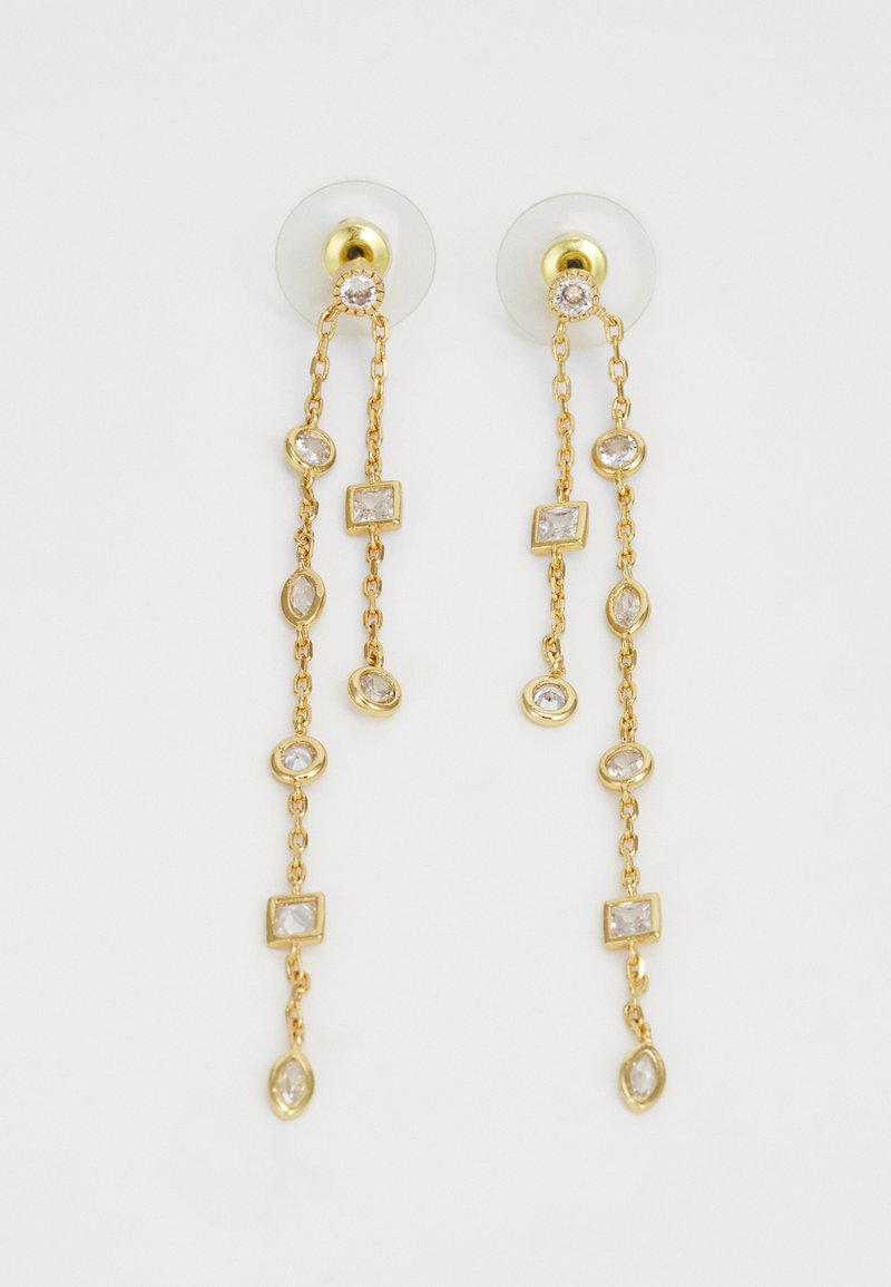 Boucles d'oreilles pendantes dorées avec un design en chaîne alternant des pierres claires rectangulaires et ovales, maintenues par des supports transparents.