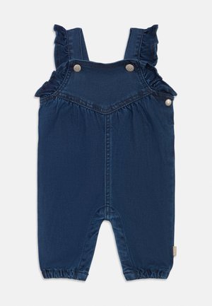 Navyblå denim babyheldragt med flæsebesatte skulderstropper, trykknapper foran og i siderne samt elastiske benåbninger.