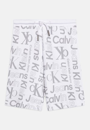 Short blanc à cordon avec texte du logo Calvin Klein Jeans gris sur toute la surface et initiales "ck" en différentes polices et tailles.