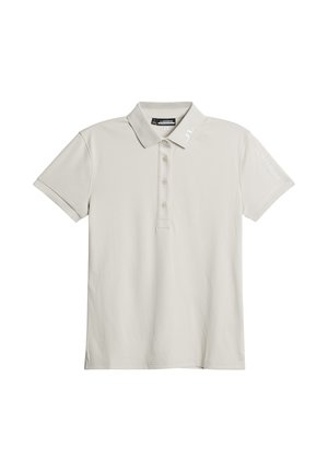 Polo in beige chiaro, realizzato in tessuto morbido con colletto, maniche corte, cinque bottoni e logo del brand ricamato sulla manica.