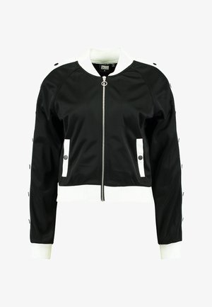 Schwarze Bomberjacke mit weißen Akzenten, mit Reißverschluss vorne, seitlichen Taschen, gerippten Bündchen und Druckknopfdetails an den Ärmeln.