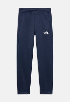 Pantalons de sport bleu marine en tissu lisse, avec une taille élastique et des poches latérales. Comprend un logo blanc sur la cuisse gauche.