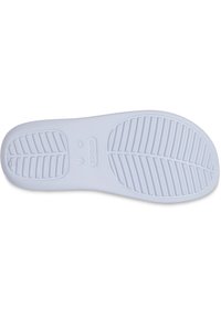 Semelle de chaussure en caoutchouc blanc avec un motif de semelle texturé, comportant des rainures parallèles et un design de bord lisse. Taille marquée comme Femme 7.