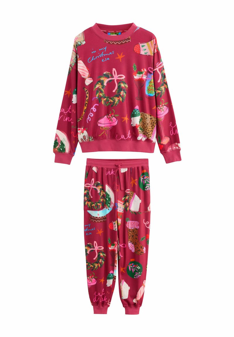 Red Christmas pajama set with wreaths, stockings, polar bears, desserts, and festive text patterns on sweatshirt and pants.