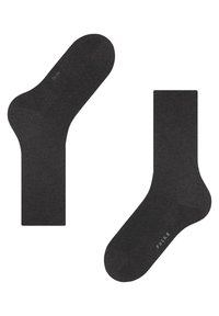 Zwarte sokken met een gladde textuur, medium lengte, versterkte teen en hiel, met een subtiele logo nabij de enkel.