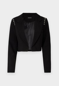 Kuttet svart blazer med snappet krage, med sølvfargede øyeleting på skuldrene og en glatt innvendig fôr. Skreddersydd design, strukturert passform.