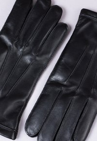 Black leather gloves with a smooth texture, featuring five fingers and subtle stitching along the seams for a tailored design.