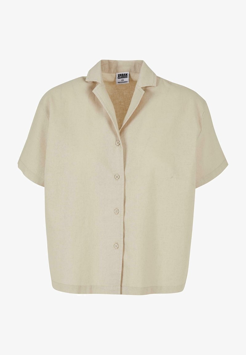 Chemise beige à manches courtes avec boutons, petit col, ourlet droit et étiquette Urban Classics XS à l'intérieur du col.