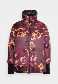 Veste matelassée en violet foncé avec un motif floral vibrant jaune, rose et orange. Dotée d'un col montant et de poignets élastiques.