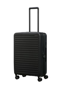 Black hard-shell suitcase with horizontal ridges, telescopic handle, four wheels for mobility, and combination lock on side.