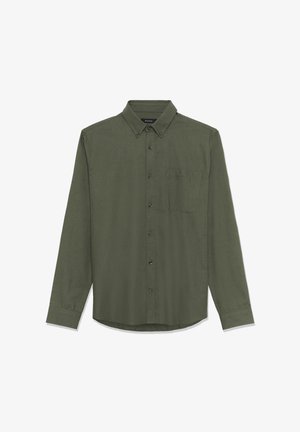 Camicia a maniche lunghe con bottoni di colore verde oliva scuro, realizzata in tessuto testurizzato, dotata di taschino sul petto e colletto a punta.