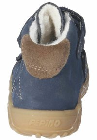 Marineblaue Lederstiefel mit einem braunen Wildlederschaft, ausgestattet mit einem weichen, weißen Innenfutter und einer flexiblen Gummisohle, die für Komfort und Unterstützung konzipiert ist.