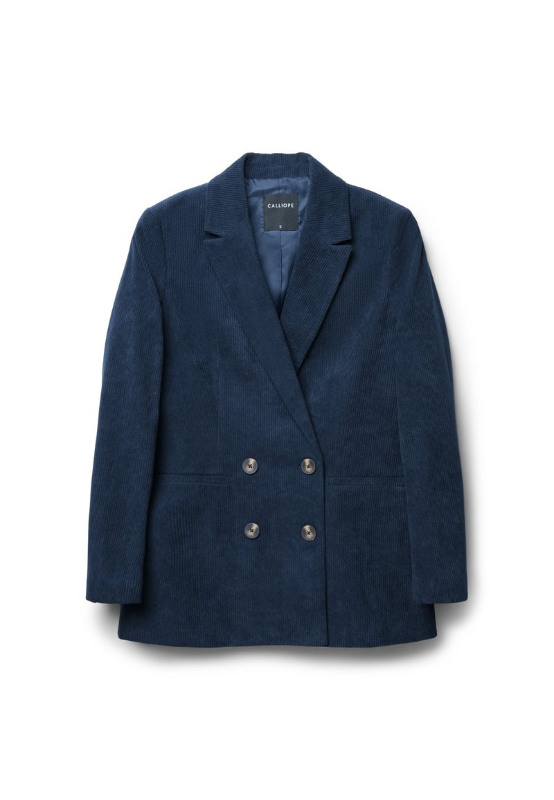 Blazer double boutonnage en velours côtelé bleu marine avec un col cranté, deux poches avant et des boutons métalliques, présentant une surface texturée.