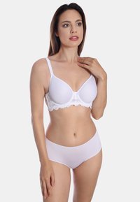 White bra with lace trim, padded cups, and adjustable straps, paired with smooth white hipster panties. Skin tone visible.