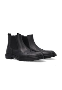 Czarne skórzane botki Chelsea z elastycznymi panelami bocznymi, zdobieniem w stylu brogue na palcach i trwałą gumową podeszwą. Gładka faktura i elegancki design.
