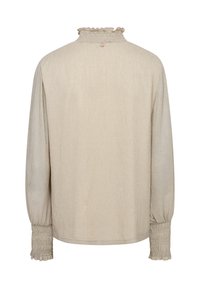 Beige longsleeve top met een gestructureerde afwerking. Voorzien van gathered manchetten en een gerimpelde hoge halslijn met een enkele knoopsluiting aan de achterkant.