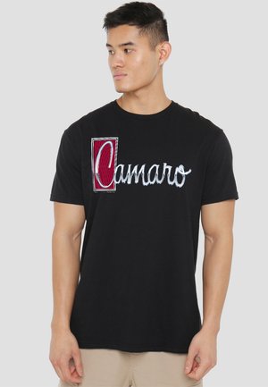 Black cotton t-shirt featuring a red and silver "Camaro" graphic print. Short sleeves and crew neckline.