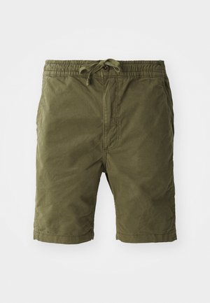Olive green shorts made of soft, textured fabric. Features an elastic waistband with a drawstring and side pockets.