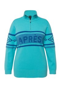 Teal tröja med halv dragkedja och krage, med en blå "APRÈS" grafik och geometriska mönster på ärmarna. Ribbad mudd och nederkant.