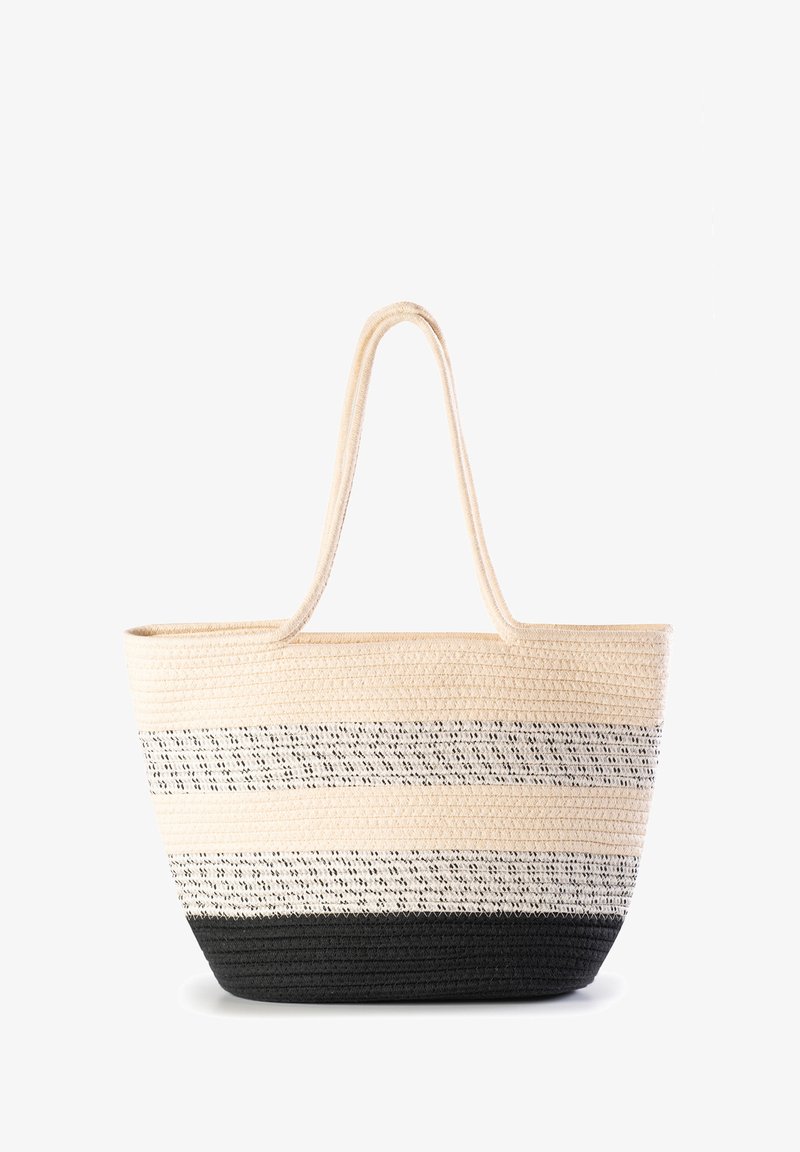 Torebka tote wykonana z tkaniny o szerokim, otwartym kształcie, w naprzemiennie ułożone beżowe, białe i czarne paski, z mocnymi, brązowymi uchwytami. Teksturowany materiał.
