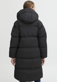 Black puffer coat with a hood, featuring a quilted design, plump sections, and a mid-length cut. Smooth, shiny texture with minimal detailing.