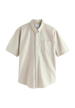 Camisa de manga corta en tejido beige claro con cuello abotonado, bolsillo delantero y diseño texturizado tejido.