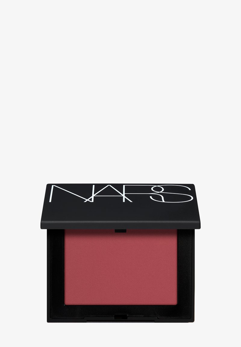 Compact rectangulaire noir avec grand logo blanc NARS, montrant un blush en poudre mat rose-rose atténué à l'intérieur.