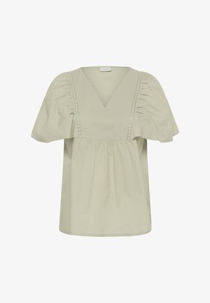 Világos bézs blúz mély V-nyakkivágással, összehúzott puffos ujjakkal és függőleges csipkebetéttel az elülső részen.