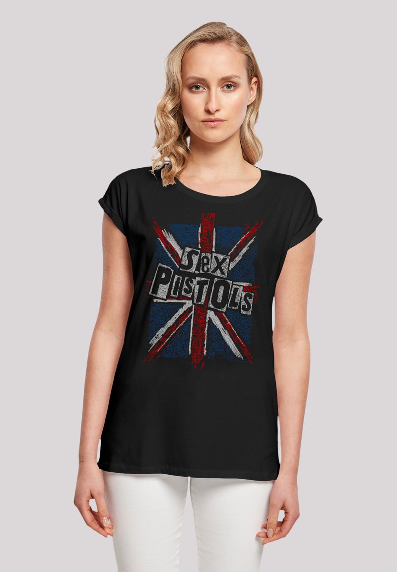 Black t-shirt featuring a distressed graphic print of the British flag and the text "Sex Pistols" in bold, contrasting colors.